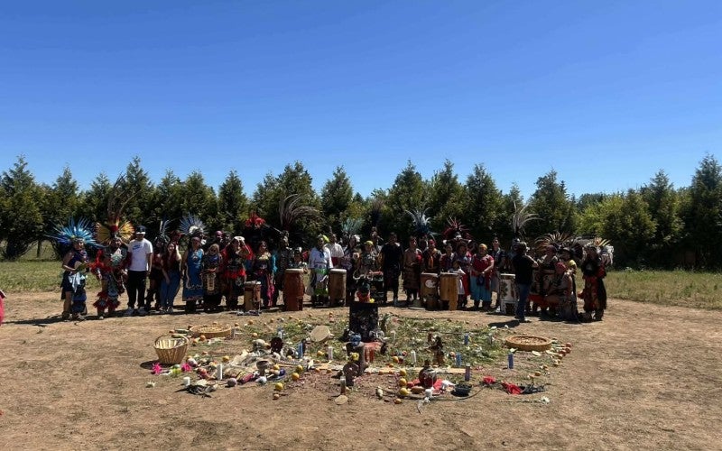 group photo in full regalia post-dance