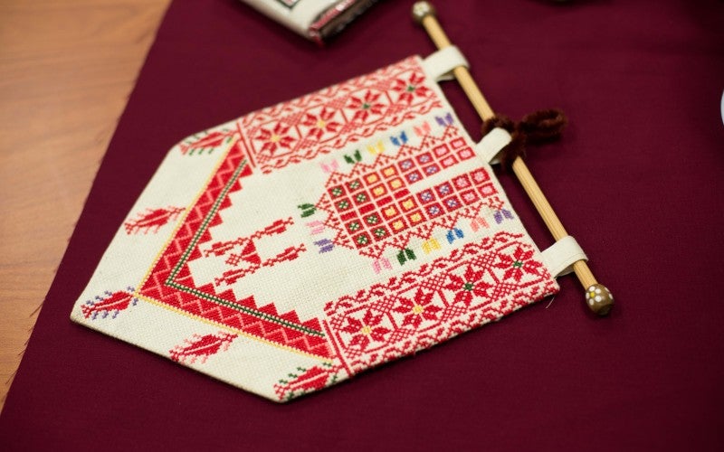 A red and white piece of embroidery