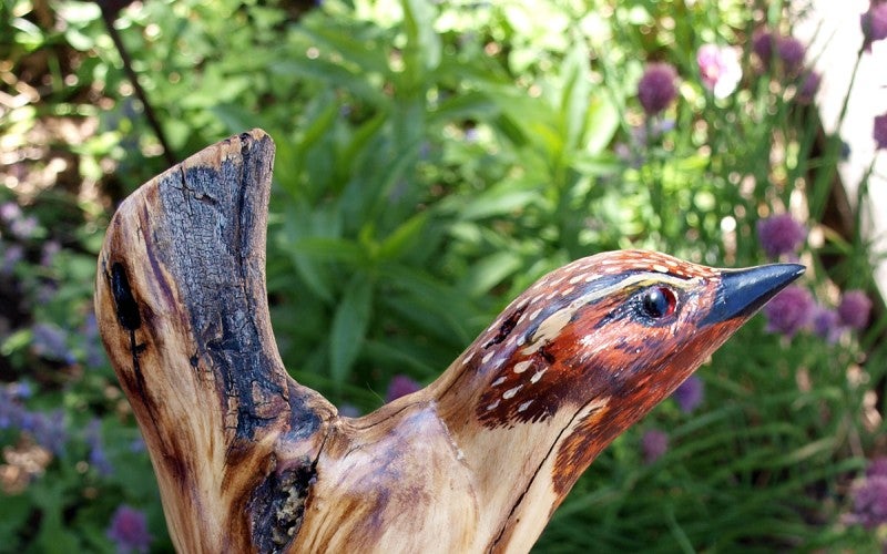 A wooden carved bird