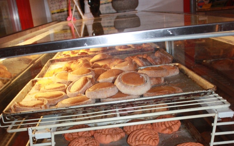 Pastries are stored on vertical racks.