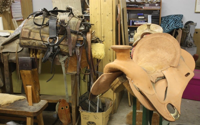 A tan Western-style saddle in Dave's workshop.