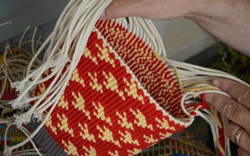 A red and yellow woven basket.
