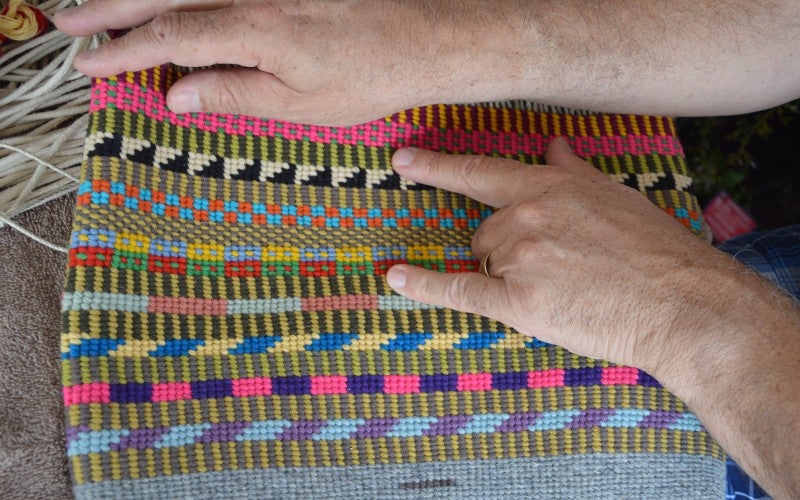 A multi-colored woven basket.