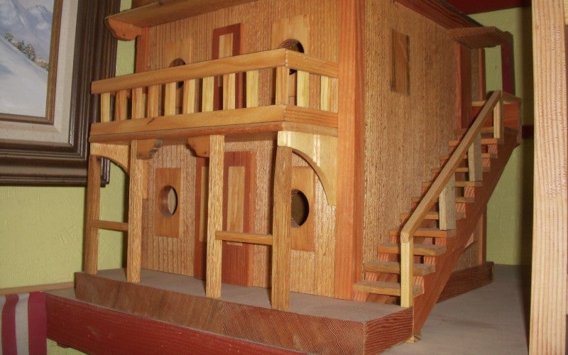 A small Western-style building replica made from wood.