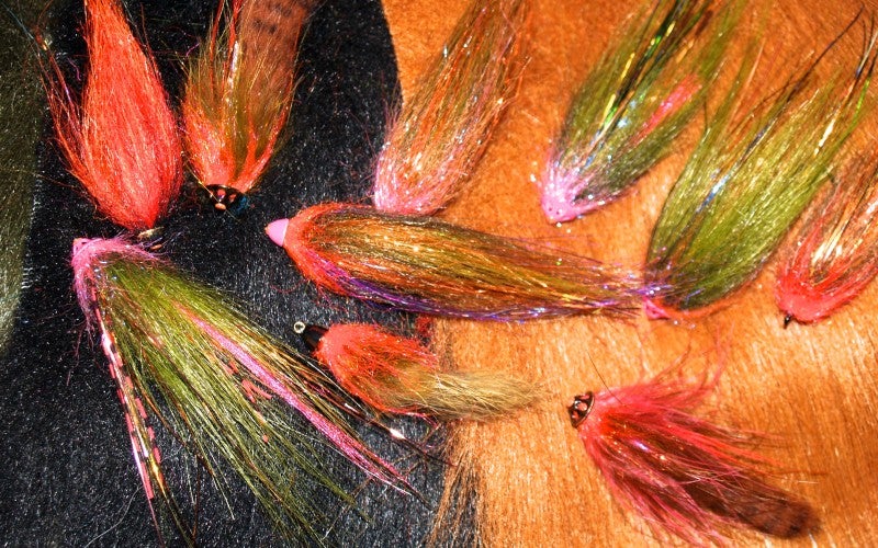 Multi-colored fly fish hooks.