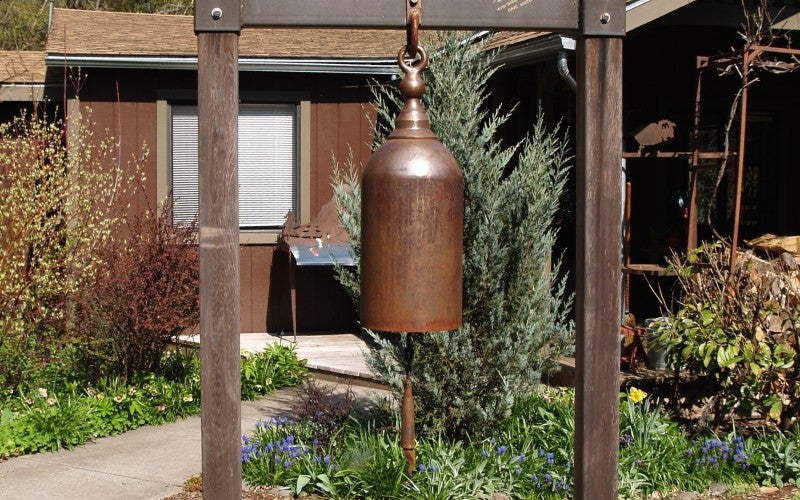 A small bell between two metal poles