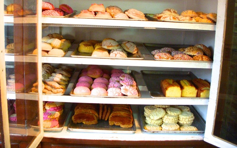 Shelves filled with pastries.