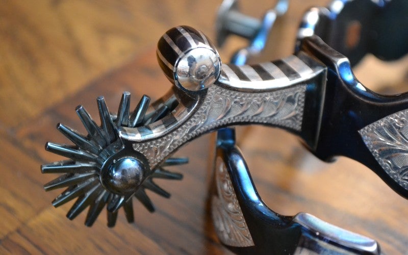 A silver boot spur.