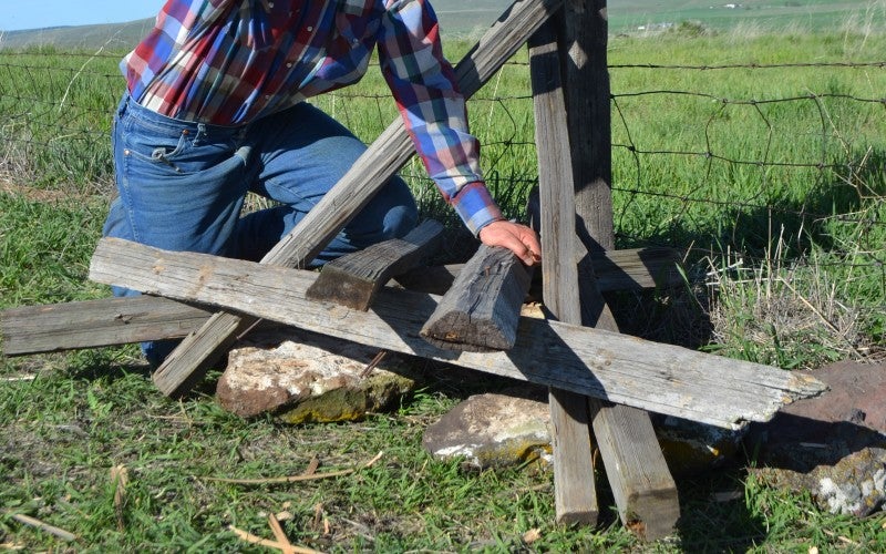 Pat Dougherty hammering a rock jack style fence