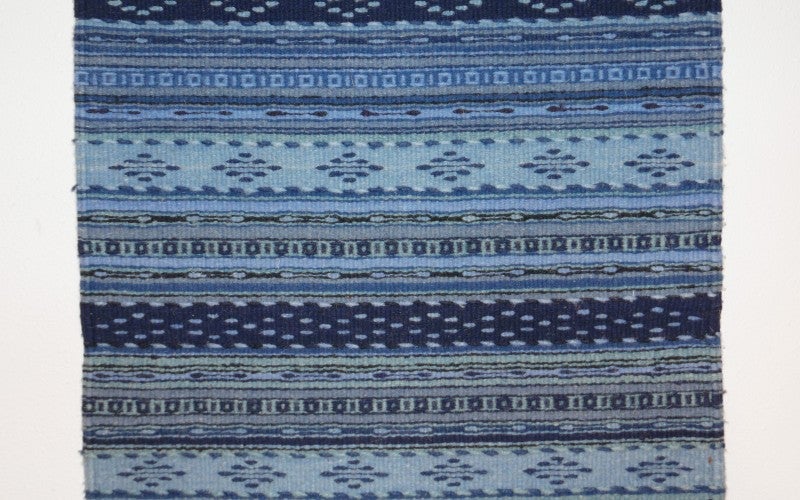 A blue patterned rug.