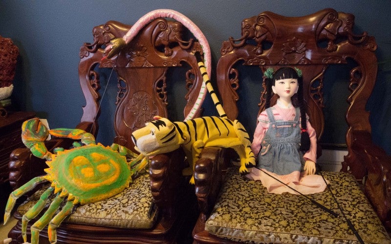 A tiger, crab, and a girl puppet