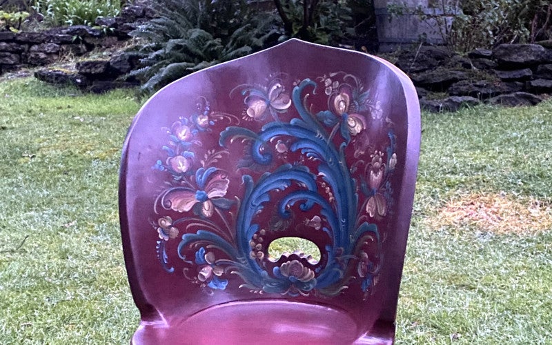 Red kubbestol or chair painted with rosemåling style decorations