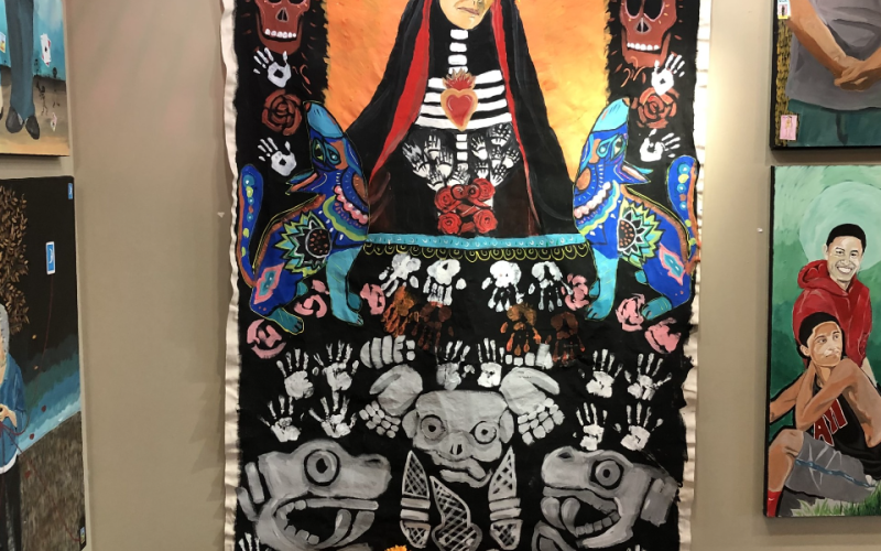 A Día de los Muertos painting done by Melendrez.