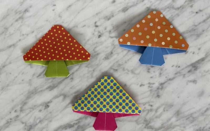 Three brightly patterned origami mushrooms