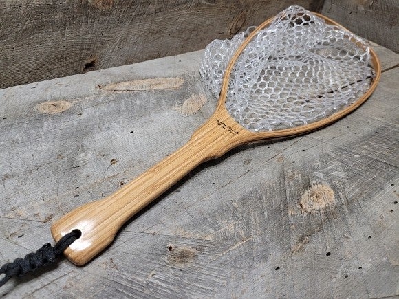 Finished fishing net with a wooden handle
