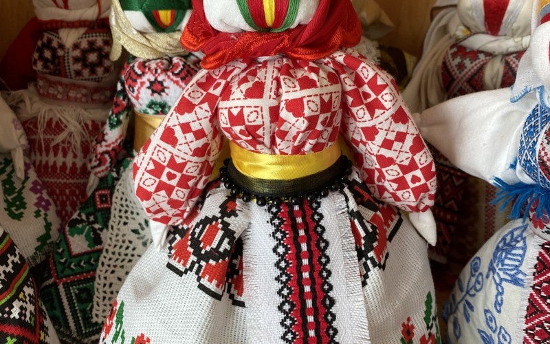 Some of Shatalova's Motanka dolls, all varying colors and made from traditional cloths.