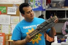 Samuel Becerra holding an Aztec Flute like instrument