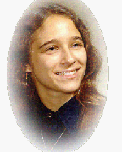 Oval framed school photo of Lisa J. Taylor wearing a dark blue shirt and a necklace.