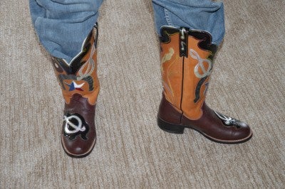 Close-up of Nelson's cowboy boots