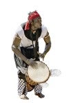 Alseny wearing white tradition clothing hunched over playing a drum. 